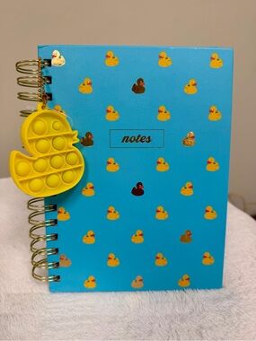 James Burke journal with Yellow Duck Pop-It Keychain